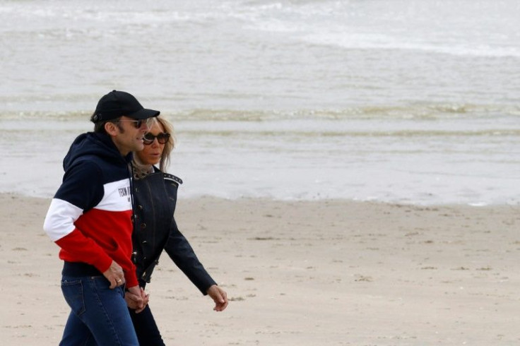 Emmanuel Macron with his wife Brigitte on Saturday in Le Touquet, northern France, where he will cast his vote Sunday