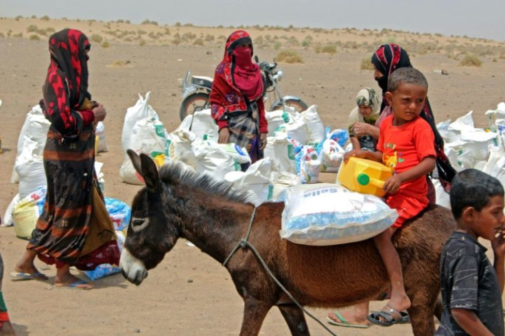 Poor Yemeni families receive basic food supplies in Lahj; years of conflict have pushed millions to the brink of famine