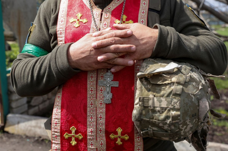 A military chaplain Maksym conducts an Orthodox Easter service for Ukrainian servicemen at their position, as Russia's attack on Ukraine continues, in Kharkiv region, Ukraine April 24, 2022.  