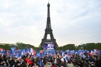 Macron, 44, is to make a victory speech at the foot of the Eiffel Tower where flag-waving supporters erupted in joy when the projections appeared