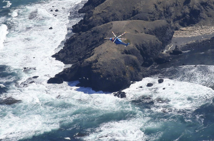 A helicopter searches for missing people aboard the missing tour boat "Kazu 1" off the Shiretoko Peninsula in Shari, Hokkaido Prefecture, Japan in this photo taken by Kyodo on April 25, 2022. Mandatory credit Kyodo/via REUTERS