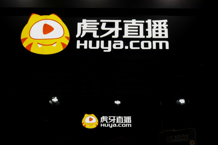 Signs of video game streaming site Huya are seen at the China Digital Entertainment Expo and Conference, also known as ChinaJoy, in Shanghai, China July 30, 2021. 