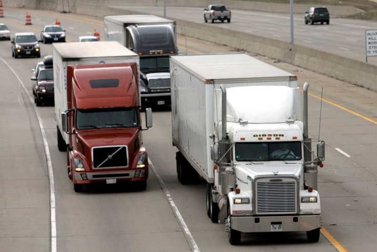 Two freight trucks are driven on the Fisher freeway in Detroit, Michigan March 27, 2009.