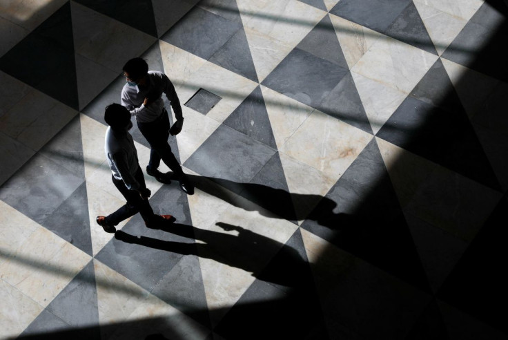 Office workers are seen at a largely empty central business district as Singapore returns to the work-from-home regime due to surging cases in the coronavirus disease (COVID-19) outbreak, in Singapore September 27, 2021. 