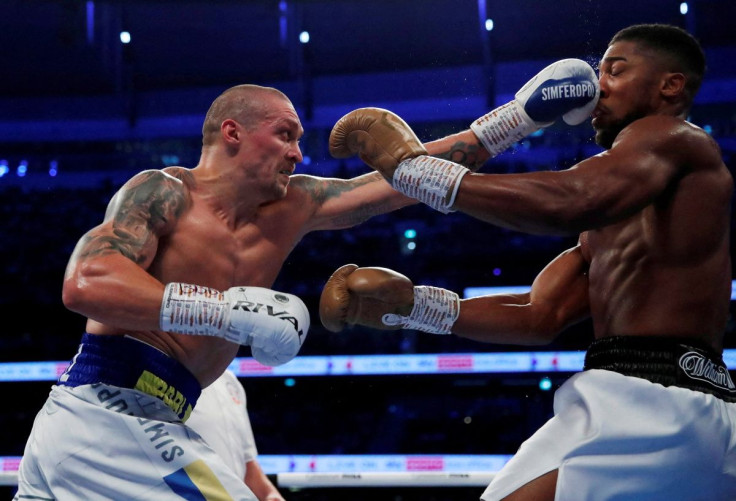 Boxing - WBA, IBF & WBO Heavyweight Titles - Anthony Joshua v Oleksandr Usyk - Tottenham Hotspur Stadium, London, Britain - September 25, 2021 Oleksandr Usyk  in action against Anthony Joshua Action Images via Reuters/Andrew Couldridge/File Photo