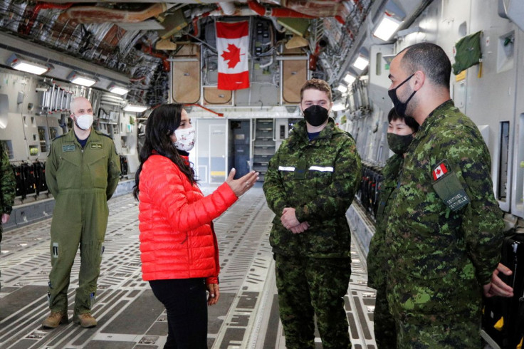 Canada's Defence Minister Anita Anand speaks with Canadian military personnel onboard a CC-17 Globemaster transport plane during a visit to highlight military aid for Ukraine at Canadian Forces Base Trenton in Trenton, Ontario, Canada, April 14, 2022.  
