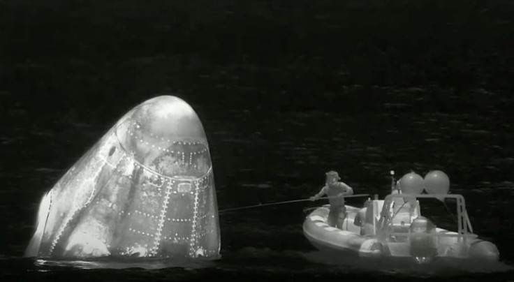 This screengrab from a NASA TV broadcast shows a recovery team following the Dragon capsule Endeavour splash down in the Atlantic Ocean with the Axiom Space Ax-1 crew