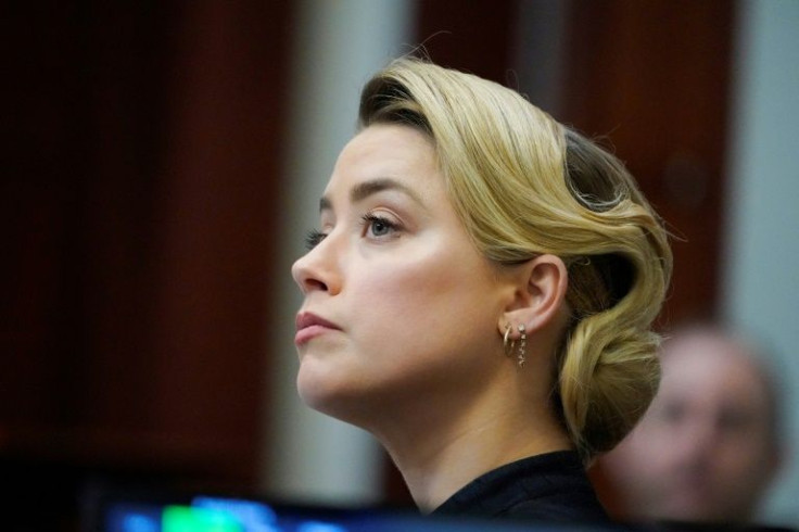 Actress Amber Heard listens to testimony at the defamation trial filed against her by her former husband Johnny Depp