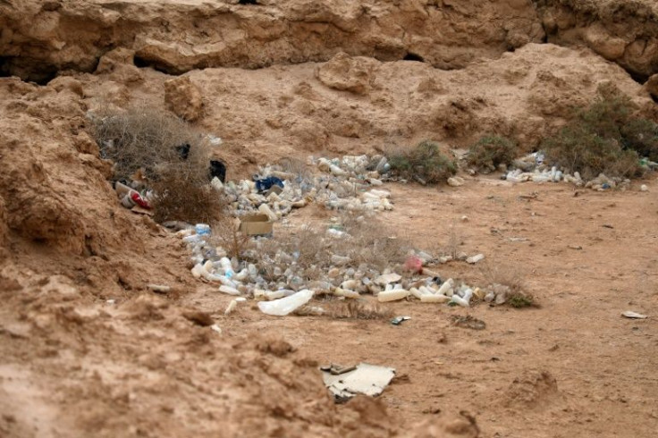 Bottles and plastic bags litter what were once the banks of Sawa Lake