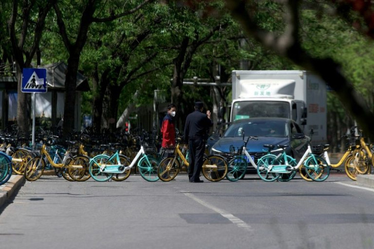 Rental bikes are seen blocking a street in Beijing's Chaoyang district