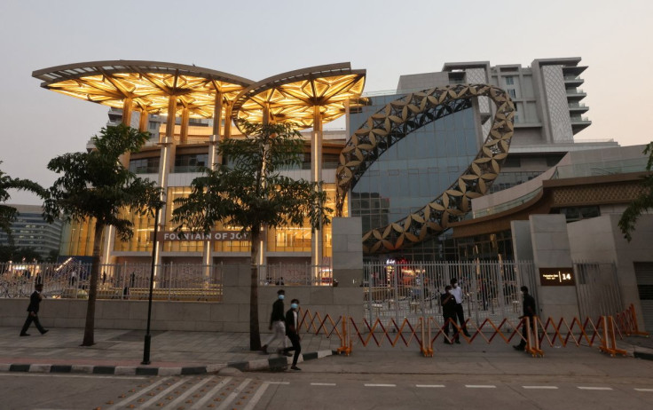 People walk outside a Reliance complex which houses Jio World Plaza mall in Mumbai, India March 10, 2022. 