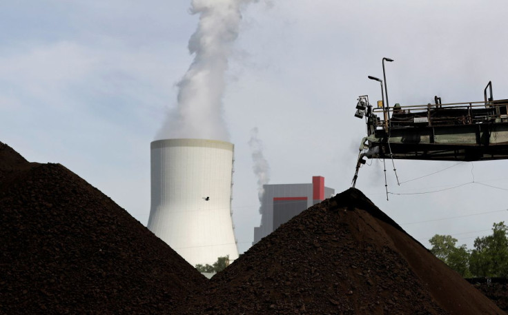 A cooling tower from the Turow coal-fired power plant is seen near the Turow open-pit coal mine operated by the company PGE in Bogatynia, Poland, June 15, 2021. 