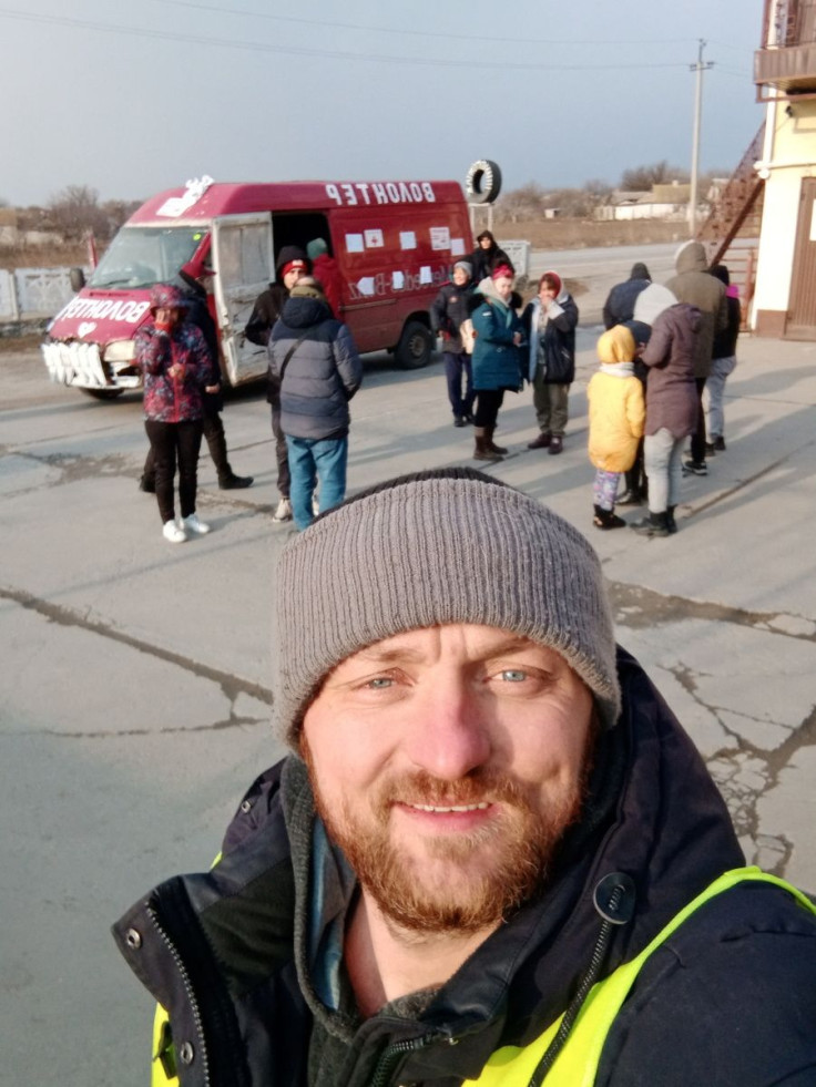 Mykhailo Puryshev poses for a selfie photo in front of a car as he evacuates people fleeing Russia's invasion of Ukraine, in Zaporizhzhia, Ukraine, in this undated handout photo obtained by Reuters on April 26, 2022. Courtesy of Mykhailo Puryshev/Handou