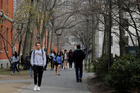 Students and pedestrians walk through the Yard at Harvard University in Cambridge, Massachusetts, U.S., March 10, 2020.   