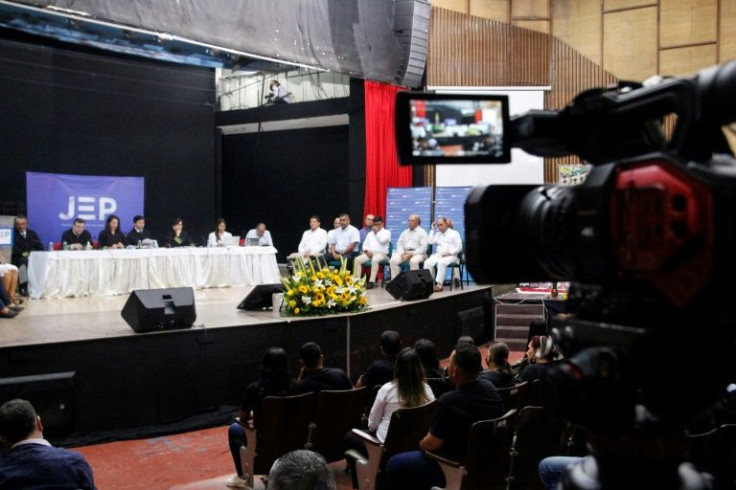 Former members of the Colombian Armed Forces speak in front of victims' families during a hearing organized by the Special Jurisdiction for Peace (JEP) in Ocana, Colombia, on April 26, 2022