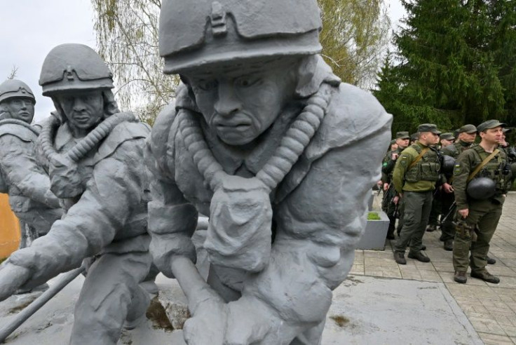 Ukrainian servicemen pay tribute to the firefighters who died during the 1986 Chernobyl disaster