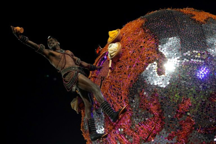 Grande Rio, a samba school from the impoverished Rio de Janeiro neighborhood of Duque de Caxias, claimed the coveted Carnival competition title for the first time for a colorful, sparkling parade dedicated to the Afro-Brazilian deity Exu