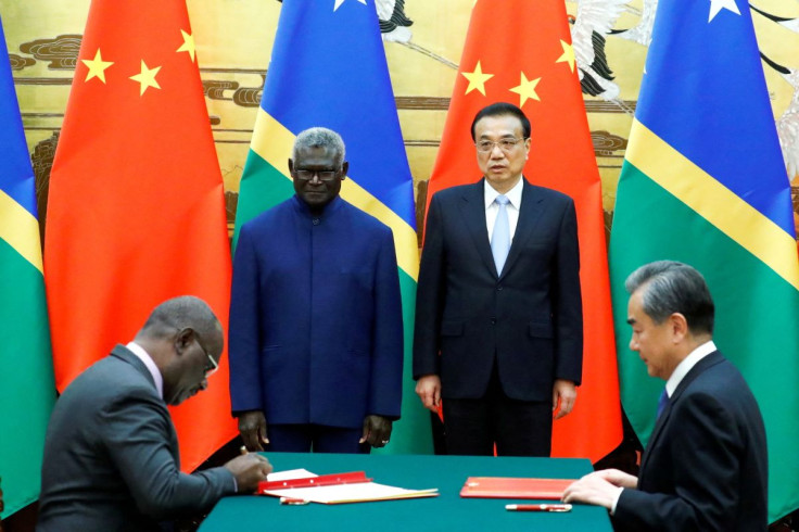 (L-R) Solomon Islands Prime Minister Manasseh Sogavare, Solomon Islands Foreign Minister Jeremiah Manele, Chinese Premier Li Keqiang and Chinese State Councillor and Foreign Minister Wang Yi attend a signing ceremony at the Great Hall of the People in Bei