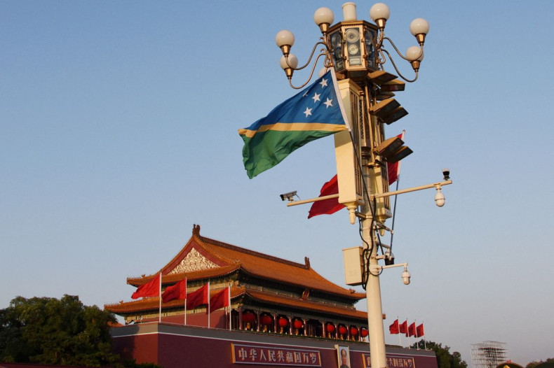 National flags of Solomon Islands and China flutter at the Tiananmen Square in Beijing, China October 7, 2019. 