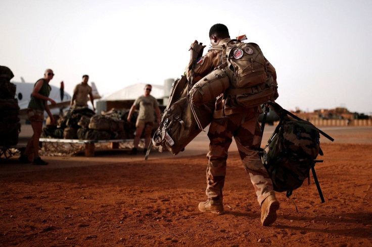 A French soldier leaves with his backpack at the Operational Desert Platform Camp (PfOD) during the Operation Barkhane in Gao, Mali, August 1, 2019.