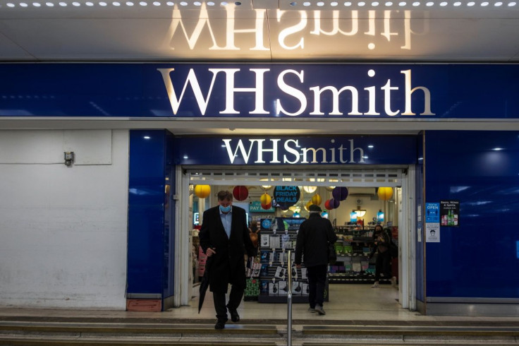 A person wearing a mask exits a branch of WH Smith in London, Britain, December 1, 2021.