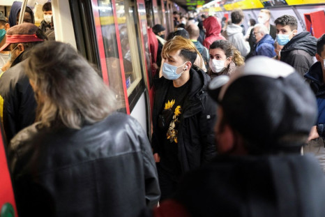 Commuters wait for the train at the subway station amid the outbreak of the coronavirus disease (COVID-19) in Barcelona, Spain January 12, 2022. 