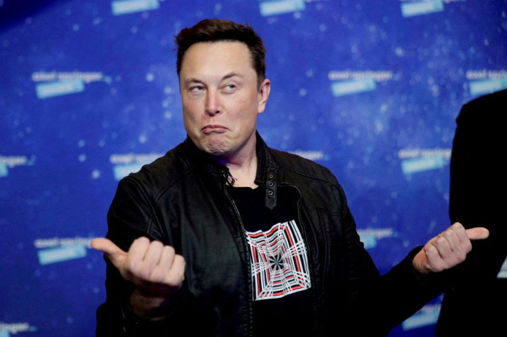 SpaceX owner and Tesla CEO Elon Musk grimaces after arriving on the red carpet for the Axel Springer award in Berlin, Germany, December 1, 2020. 