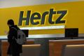 A person walks by the counter of Hertz rental car at John F. Kennedy International Airport in Queens, New York City, U.S., March 30, 2022. 