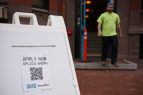 An "Apply Now" sign stands outside the new Faccia Brutta Bar Pallino looking to hire employees on Newbury Street in Boston, Massachusetts, U.S., April 27, 2022. 