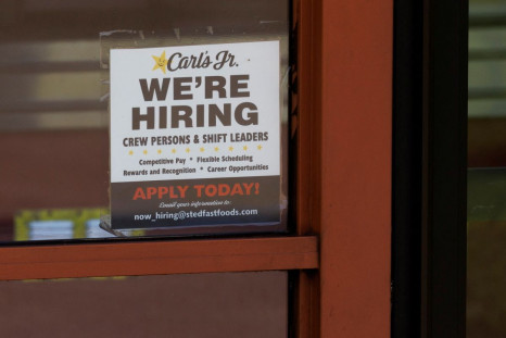A help wanted sign is shown at a fast food restaurant in Solana Beach, California, U.S. November, 9, 2021. 