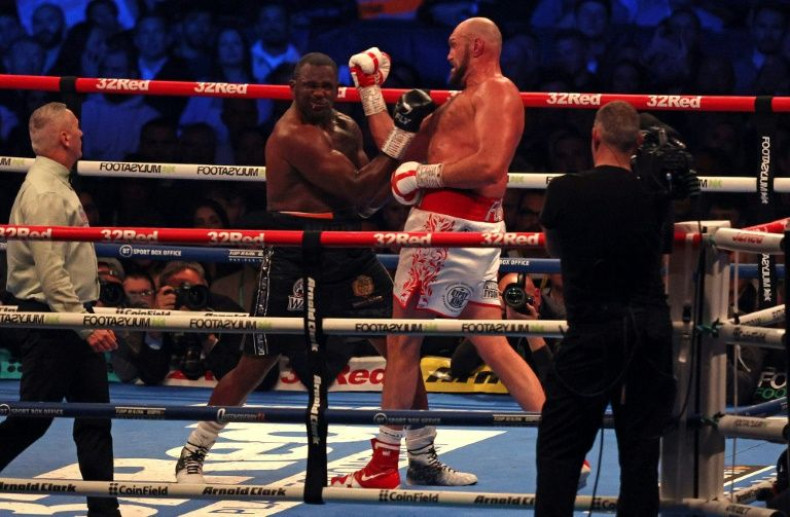 Britain's Tyson Fury (R) lands a punch to knock out Dillian Whyte