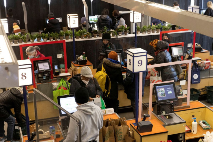 People pay for their purchases at a supermarket in Manhattan, New York City, U.S., March 28, 2022. 