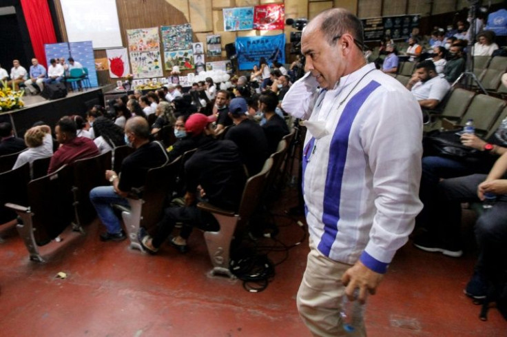 'I assume this legal responsibility... so that the Colombian people never again, never live again, these abominable moments,' Paulino Coronado said