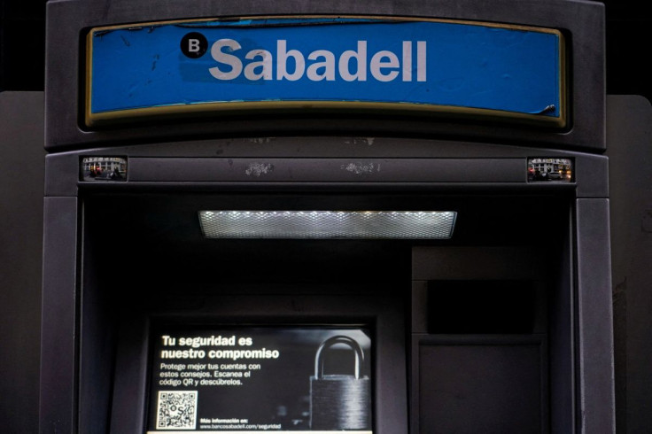 Sabadell bank's logo is seen at an ATM machine outside one of the bank's branches in Madrid, Spain, November 17, 2020. 