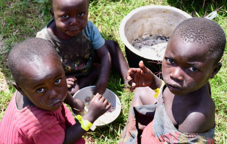 FILE PHOTO; Congolese children share a meal at a temporary camp after fleeing from the renewed fighting between the assailants and army troops of the Democratic Republic of Congo and Uganda, at the Bunagana border crossing point in Western Uganda November