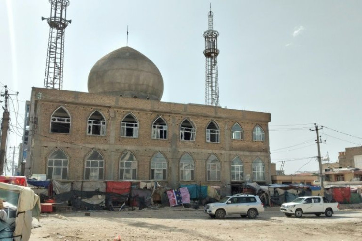 The latest bombings in Afghanistan, aboard two minibuses in Mazar-i-Sharif, come one week after an explosion left 12 dead at a Shiite mosque, shown here, in the same city on April 21, 2022