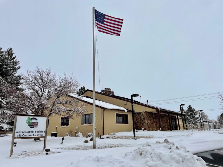 A U.S. flag flies at the office of Clerk Dallas Schroeder in Kiowa, Colorado, U.S., March 17, 2022. Picture taken March 17, 2022.