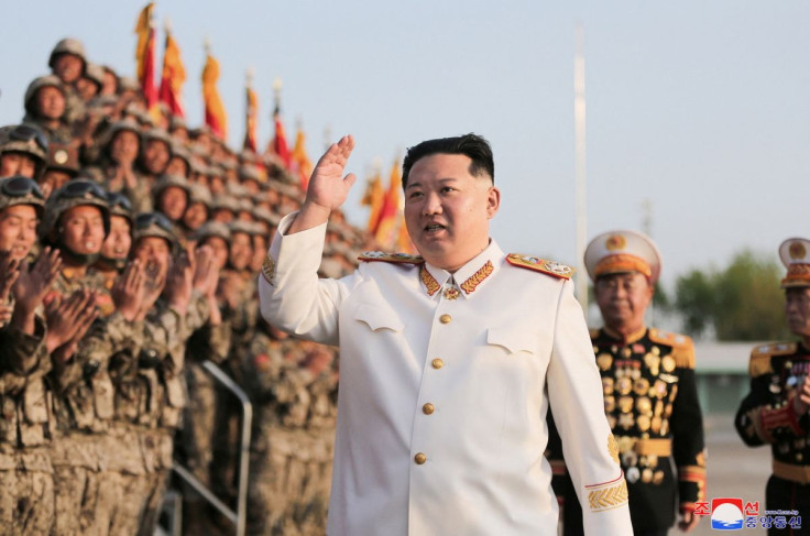 North Korean leader Kim Jong Un meets troops who have taken part in the military parade to mark the 90th anniversary of the founding of the Korean People's Revolutionary Army, in this undated photo released by North Korea's Korean Central News Agency (KCN