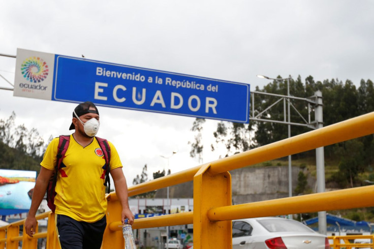 A man walks with a face mask, amid the new coronavirus outbreak, at Rumichaca border bridge in Tulcan, Ecuador March 1, 2020. 