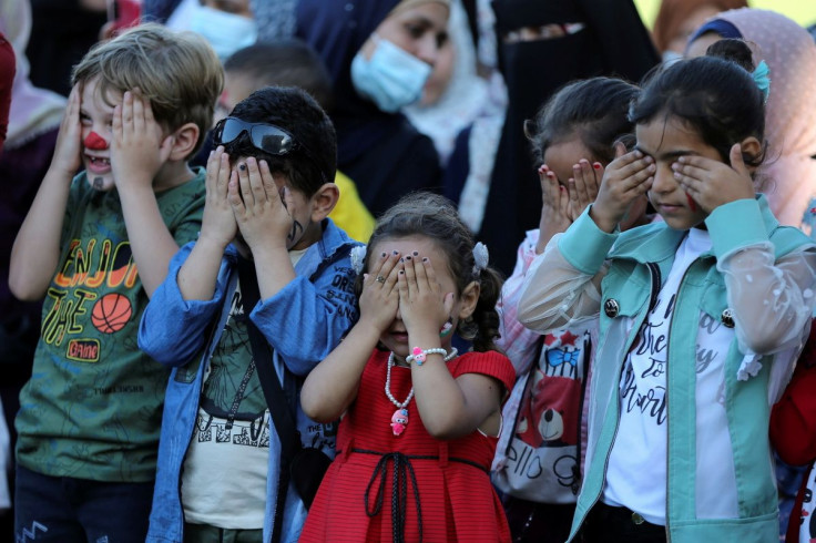 Palestinian children participate in a mental health support session in Khan Younis in the southern Gaza Strip, June 6, 2021.
