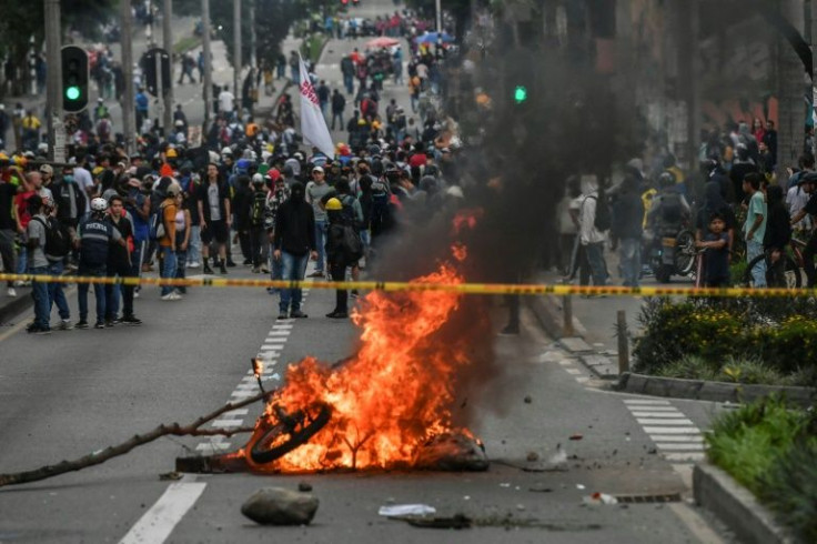 Demonstrators burn a barricade during a protest against the government of Colombian President Ivan Duque in Medellin on April 28, 2022
