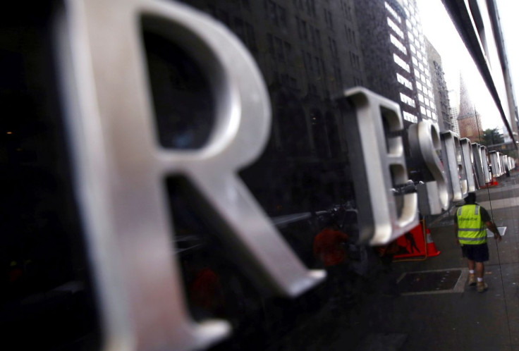 A worker is reflected in a wall of the Reserve Bank of Australia (RBA) head office in central Sydney, Australia, March 1, 2016.   