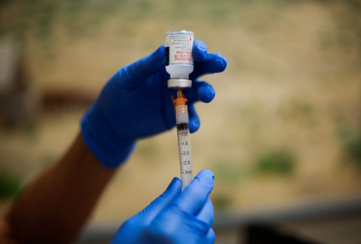 A healthcare worker prepares the Moderna vaccine against the coronavirus disease (COVID-19) at a vaccination centre, in El Paso, Texas, U.S May 6, 2021. Picture taken May 6, 2021.  