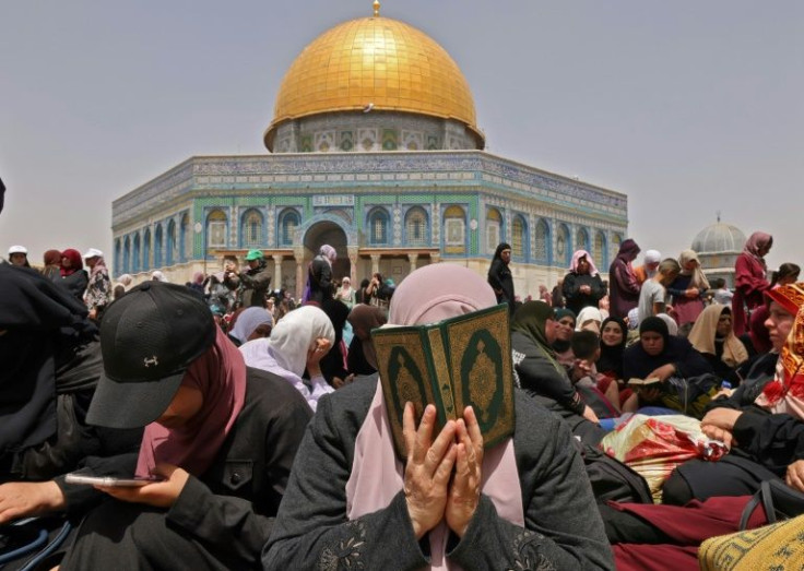 Palestinian worshippers mark Quds (Jerusalem) Day during the last Friday prayers of the Muslim fasting month of Ramadan, outside the Dome of the Rock mosque at the Al-Aqsa mosque compound in Jerusalem's old city