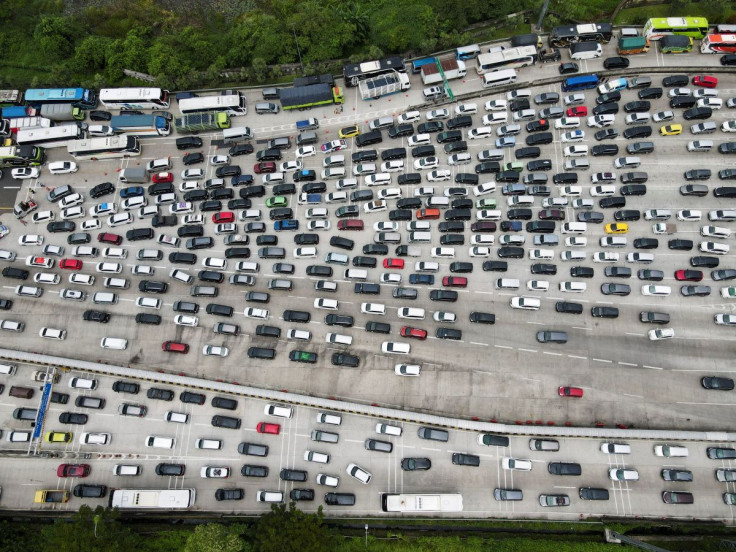 A general view of a traffic jam at a toll booth of a highway as Indonesian Muslims return to their hometowns to celebrate Eid al-Fitr, known locally as 'Mudik', in Karawang Regency, on the outskirts of Jakarta, Indonesia, April 28, 2022. Picture taken wit