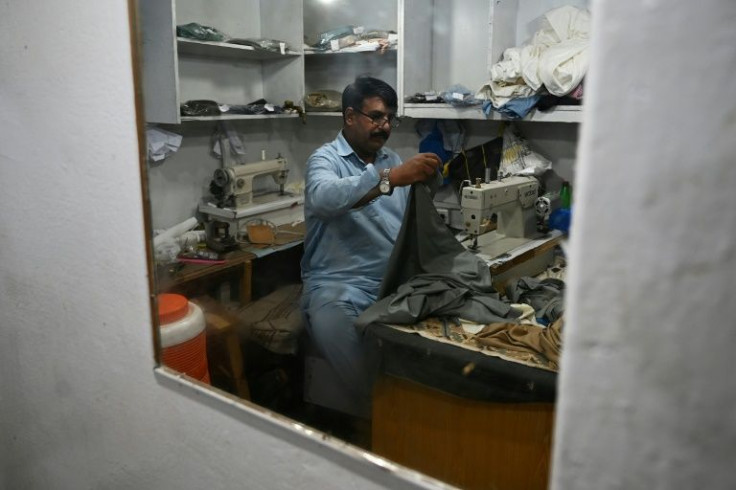 Muhammad Razzaq said two armed men barged into his Islamabad store before making off with 240 completed or near-finished shalwar kameez outfits