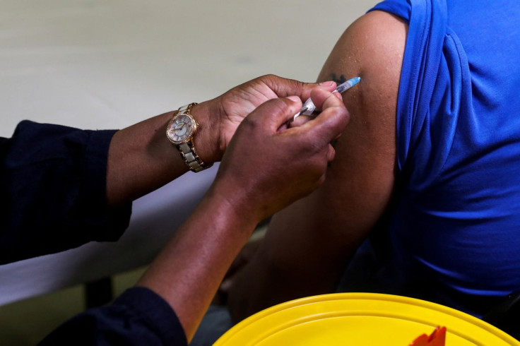A healthcare worker administers the Pfizer coronavirus disease (COVID-19) vaccine to a man, amidst the spread of the SARS-CoV-2 variant Omicron, in Johannesburg, South Africa, December 9, 2021. 