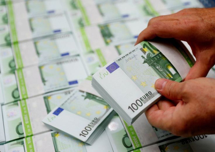 An employee checks 100 Euro banknotes at the Money Service Austria company's headquarters in Vienna, Austria, November 16, 2017.