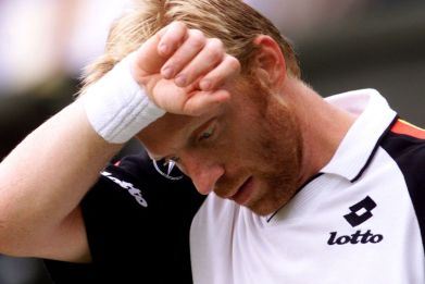 Tennis - Wimbledon, June 30, 1999 Germany's Boris Becker looks down during his fourth round match against Australia's Pat Rafter Reuters/Kieran Doherty/