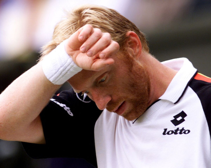 Tennis - Wimbledon, June 30, 1999 Germany's Boris Becker looks down during his fourth round match against Australia's Pat Rafter Reuters/Kieran Doherty/